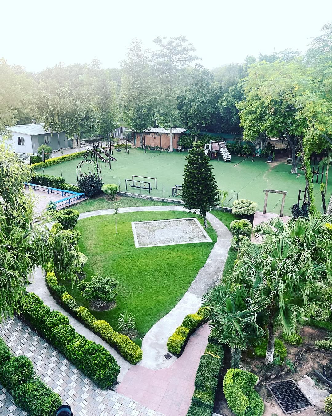 Lawns, pathways and play area at PSI